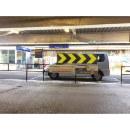 Parking signage arrow with reflectors