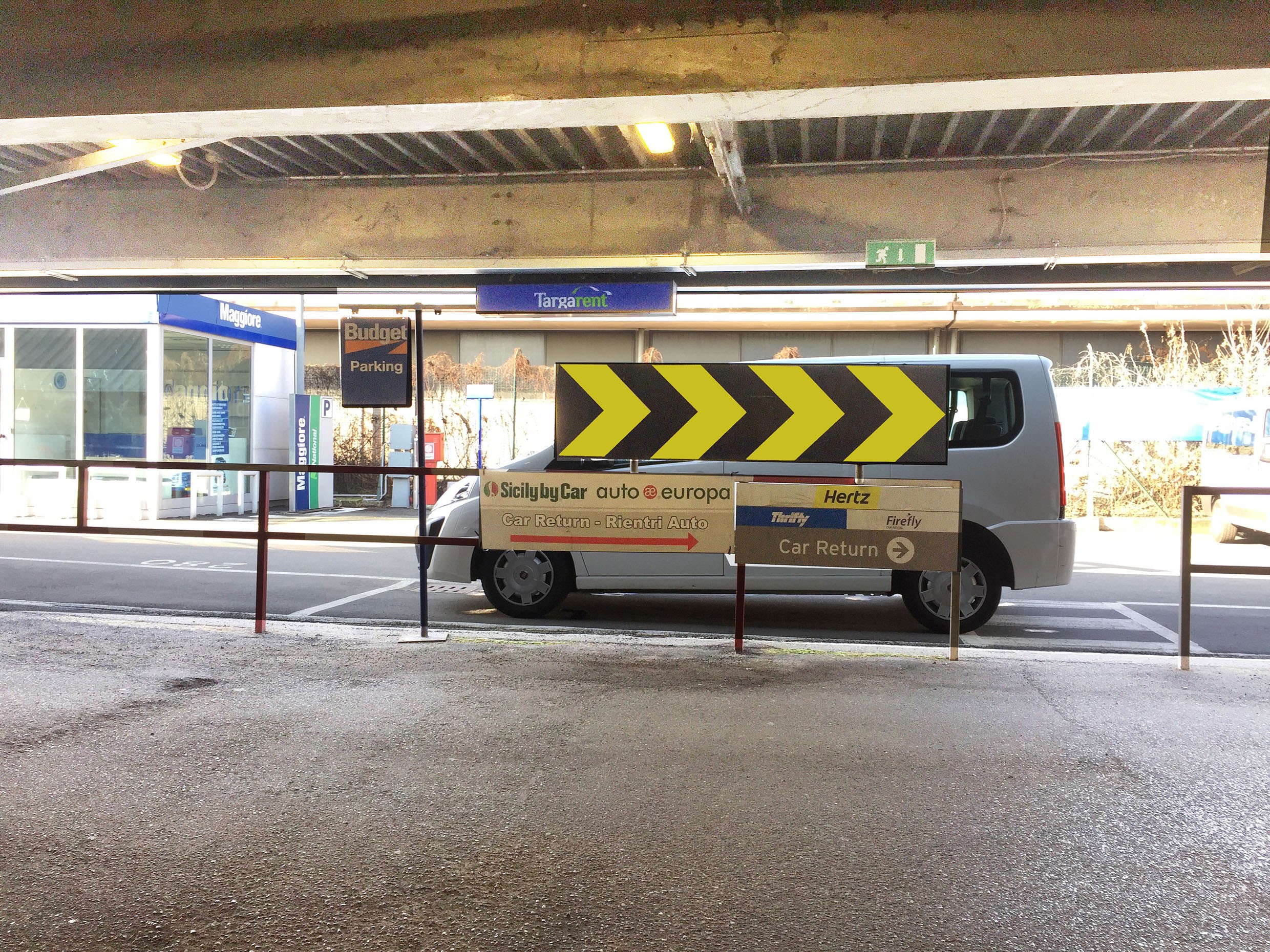 Parking signage arrow with reflectors